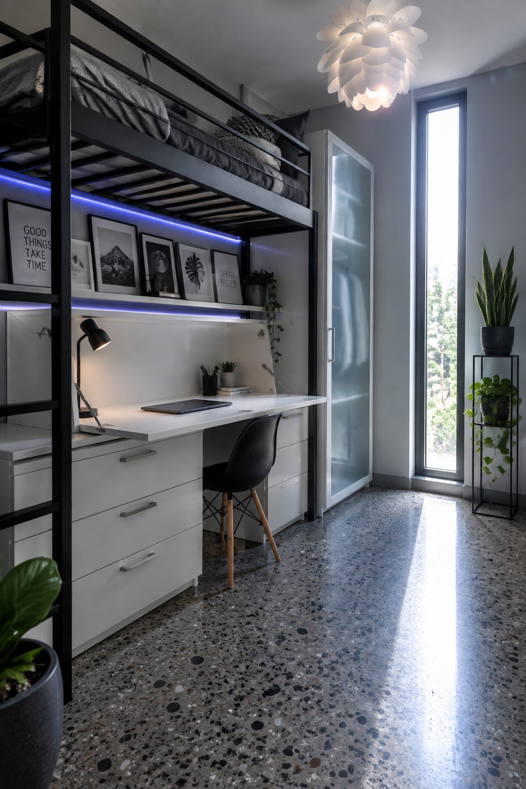 A modern teen bedroom featuring a black metal loft bed above a white desk and storage unit with blue LED strip lighting, a black chair, and a tall window on the right side.