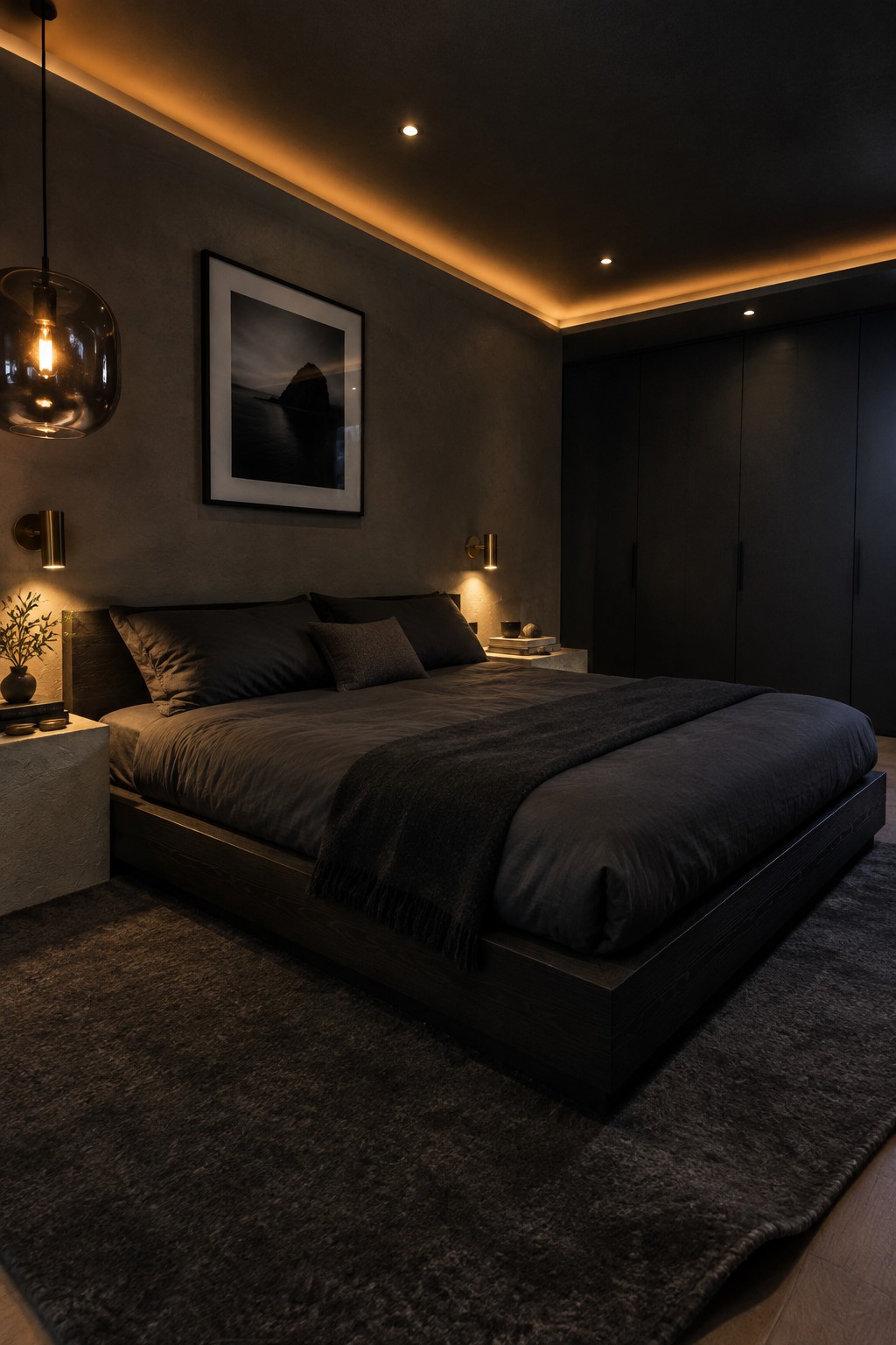 A modern bedroom featuring a low-profile wooden bed with dark bedding, dark walls, and warm cove lighting along the ceiling perimeter with recessed ceiling lights.