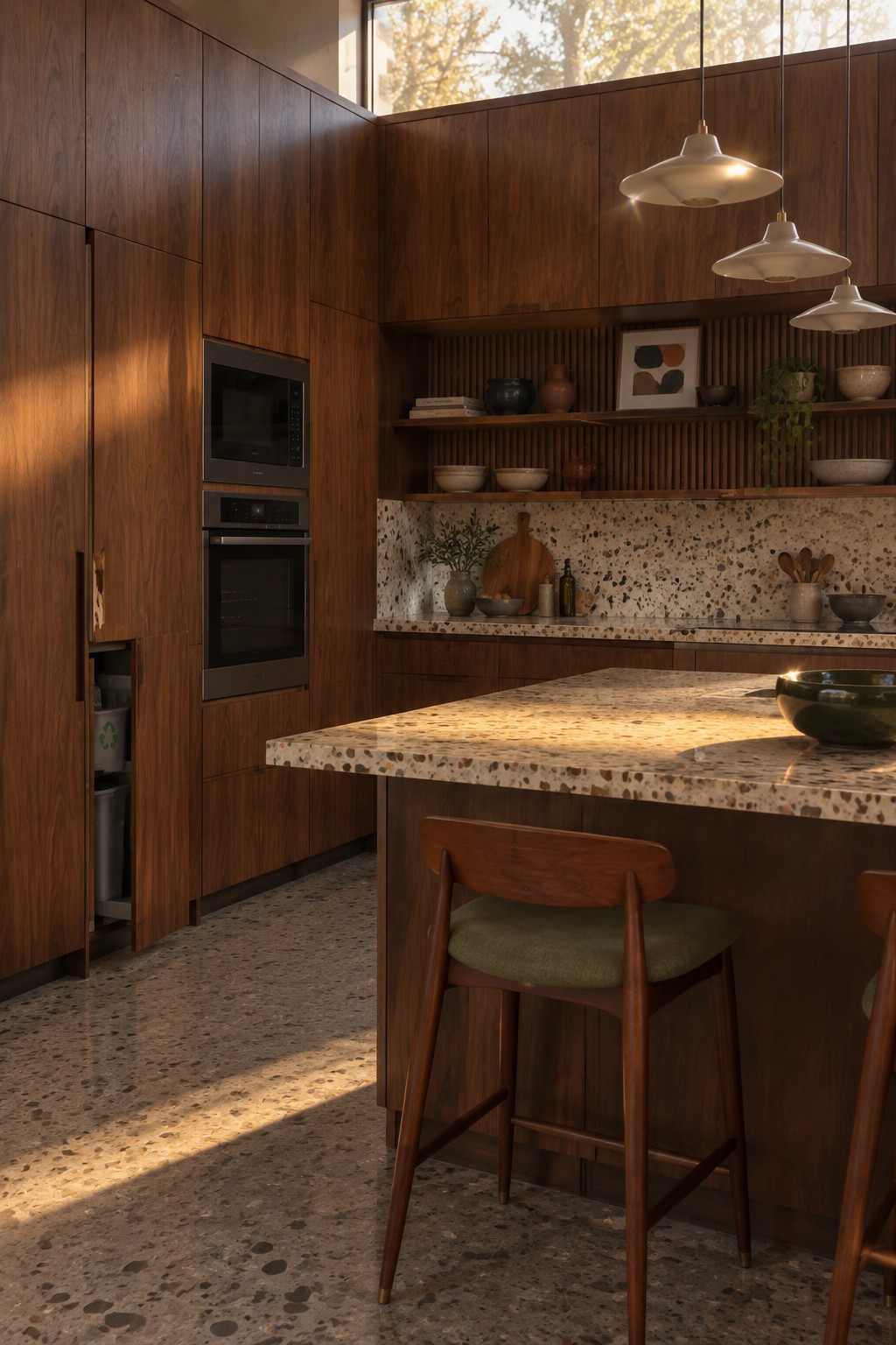 Modern kitchen with dark wood cabinets, terrazzo island, pendant lights, and bar stools in sunlight