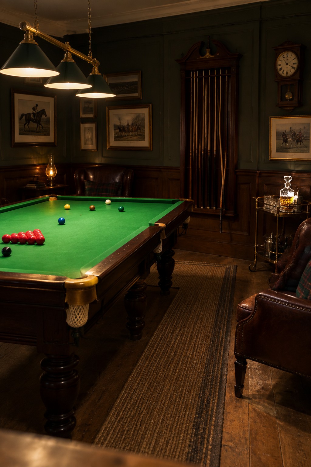 Dark wood billiards room with green felt table, leather chairs, and bar cart